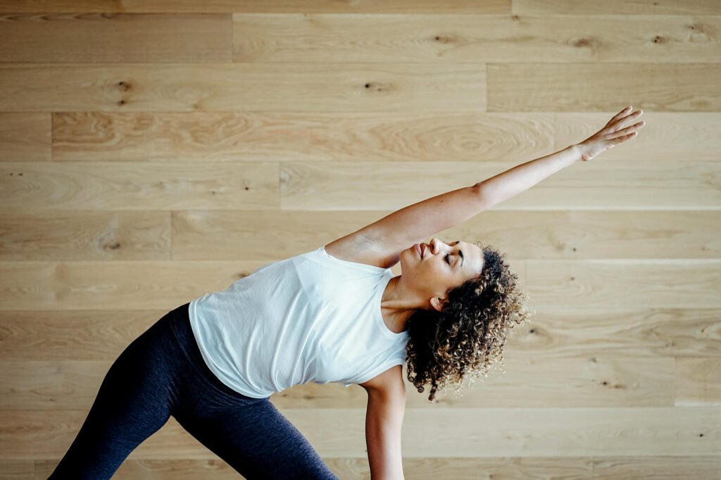 Triangle Pose (Trikonasana) during a yoga session in Austin, Texas